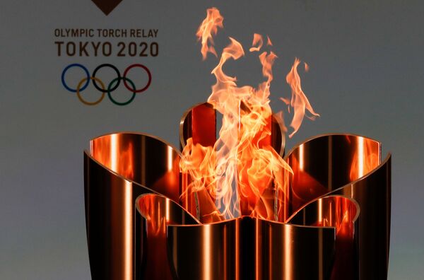 Олимпийский огонь во время эстафеты олимпийского огня в Токио-2020 в префектуре Фукусима, Япония Олимпийский огонь во время эстафеты олимпийского огня в Токио-2020 в префектуре Фукусима, Япония - Sputnik Латвия