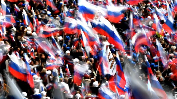 Участники митинга-концерта в Лужниках, посвященного воссоединению Крыма с Россией - Sputnik Latvija