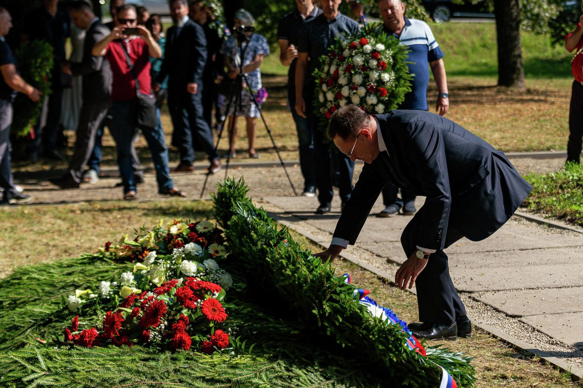 Церемония перезахоронения останков советских артиллеристов в Екабпилсе Церемония перезахоронения останков советских артиллеристов в Екабпилсе - Sputnik Латвия, 1920, 20.08.2022