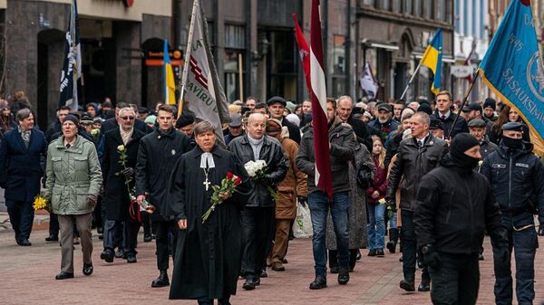 Шествие в честь Латышского легиона СС в Риге, 16 марта 2023 года - Sputnik Латвия
