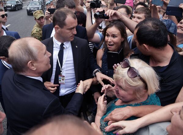 Президент РФ Владимир Путин на праздновании Дня ВМФ РФ в Санкт-Петербурге Президент РФ Владимир Путин на праздновании Дня ВМФ РФ в Санкт-Петербурге - Sputnik Латвия