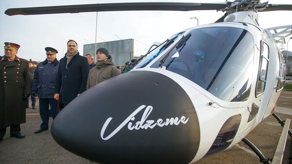 Глава МВД Латвии Сандис Гиргенс на церемонии приемки вертолетов AW 119 Kx - Sputnik Latvija