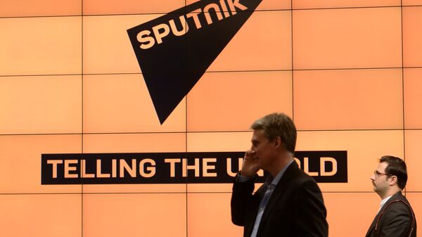 Логотип международного информационного бренда Sputnik - Sputnik Latvija