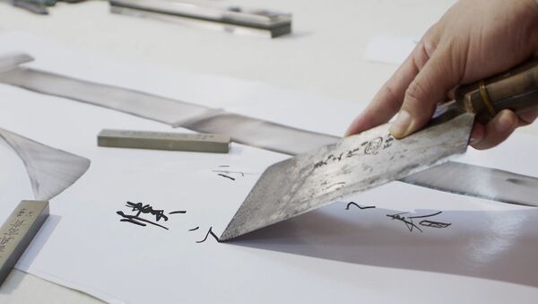 Китайский каллиграф рисует иероглифы поварскими ножами - Sputnik Латвия